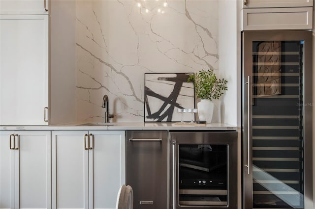bar featuring beverage cooler and indoor wet bar