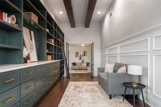 spacious closet with visible vents, beam ceiling, and dark wood finished floors