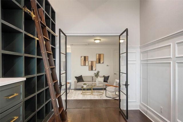 interior space featuring dark wood-style flooring and ornamental molding