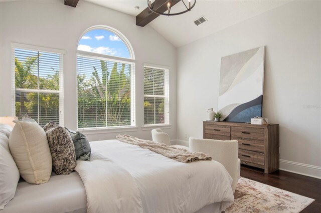 bedroom featuring dark wood-style floors, visible vents, baseboards, and lofted ceiling with beams