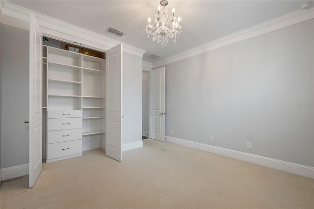 unfurnished bedroom featuring ornamental molding, baseboards, a chandelier, and light carpet