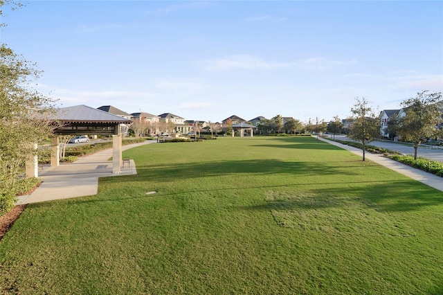 view of home's community featuring a gazebo, a residential view, and a lawn