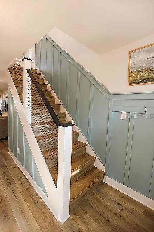 stairway featuring hardwood / wood-style floors