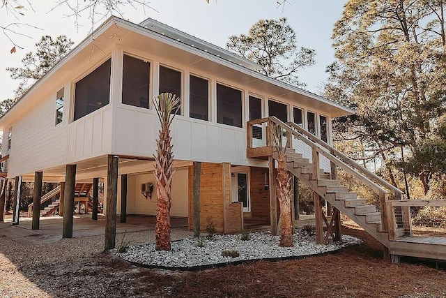 exterior space featuring a patio and a sunroom