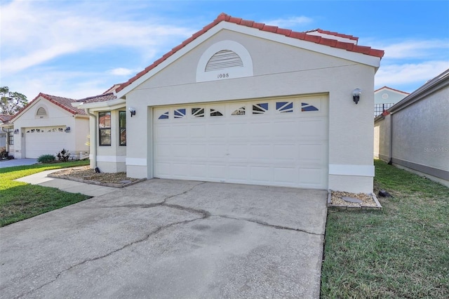 1008 Birkdale Trl, Winter Springs, FL 32708 - view of front of house featuring a tile roof, driveway, an attached garage, and stucco siding