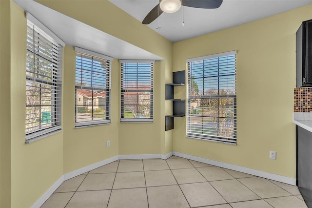 1008 Birkdale Trl, Winter Springs, FL 32708 - spare room with light tile patterned floors, a ceiling fan, and baseboards