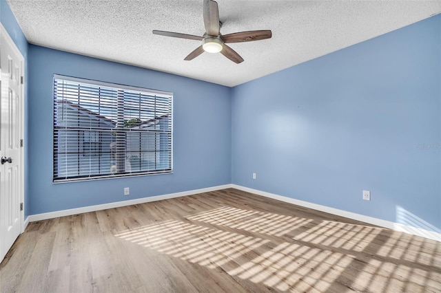 1008 Birkdale Trl, Winter Springs, FL 32708 - spare room with light wood-style floors, ceiling fan, a textured ceiling, and baseboards