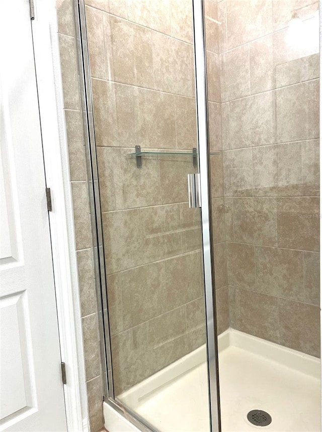 bathroom with a stall shower