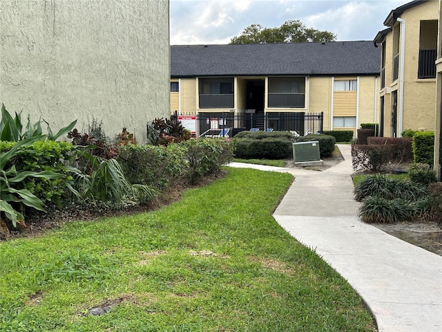 view of community featuring a lawn