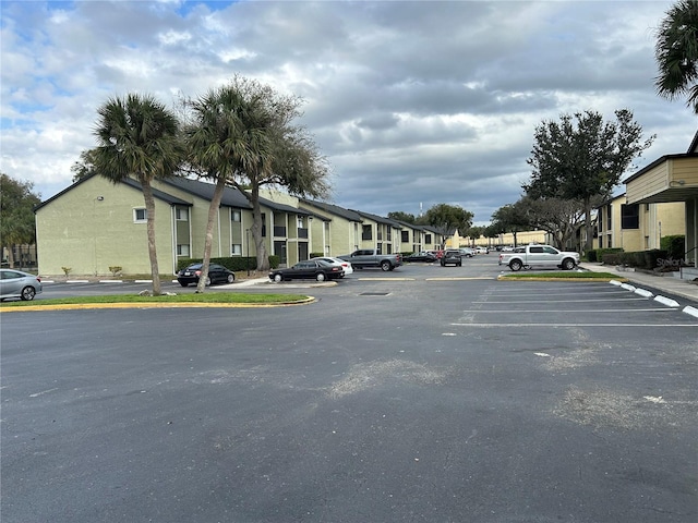 view of street featuring a residential view and curbs