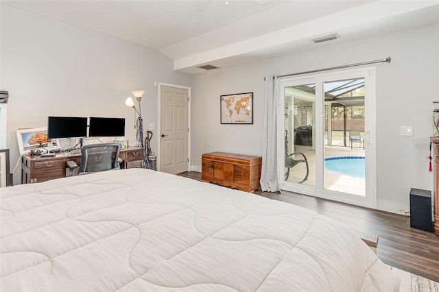 bedroom featuring wood finished floors, visible vents, baseboards, vaulted ceiling, and access to exterior