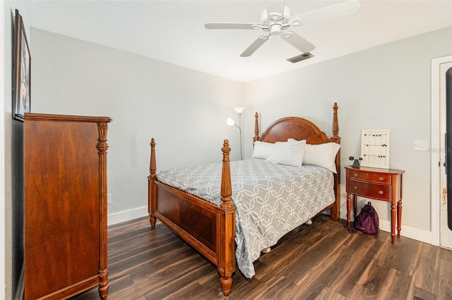 bedroom with a ceiling fan, wood finished floors, visible vents, and baseboards