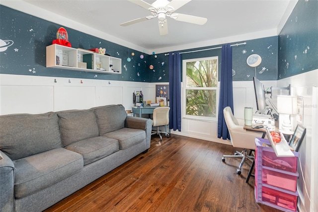 office featuring a decorative wall, a wainscoted wall, a ceiling fan, wood-type flooring, and wallpapered walls