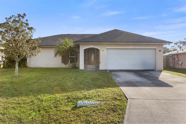 ranch-style home with a garage and a front lawn