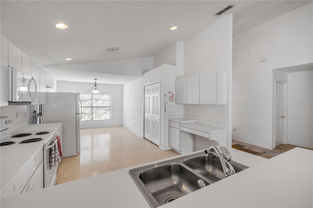 kitchen featuring white electric range, a sink, visible vents, white cabinets, and vaulted ceiling