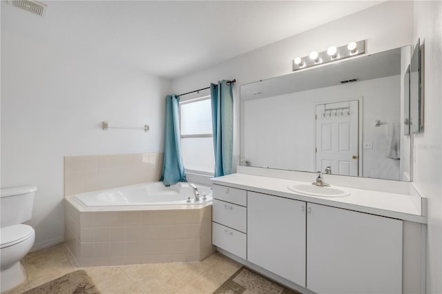 bathroom featuring visible vents, toilet, vanity, tile patterned flooring, and a bath