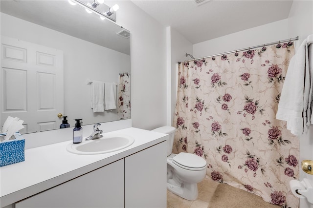 bathroom featuring toilet, a shower with curtain, tile patterned flooring, and vanity