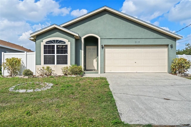 ranch-style house featuring stucco siding, concrete driveway, an attached garage, fence, and a front lawn