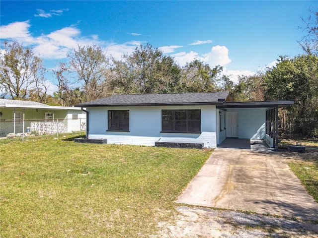 single story home featuring a front lawn and a carport