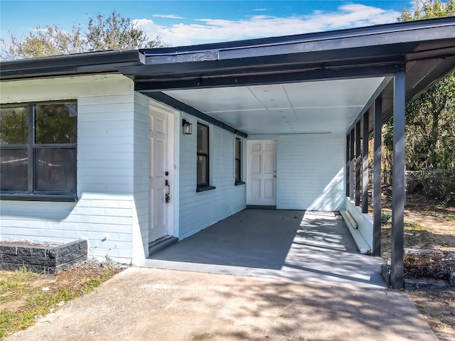 view of home's exterior with a carport