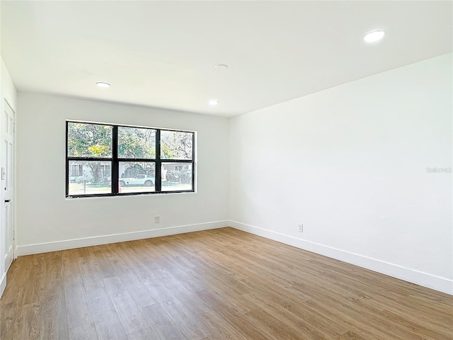 unfurnished room featuring light hardwood / wood-style flooring