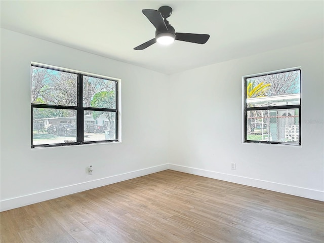 unfurnished room with ceiling fan and light hardwood / wood-style flooring