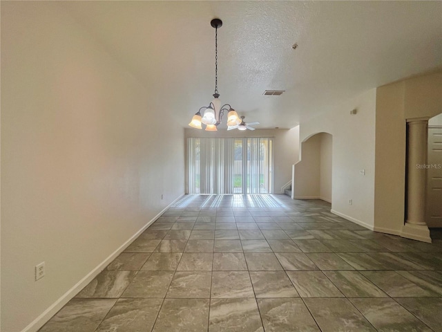 spare room featuring arched walkways, visible vents, a textured ceiling, a chandelier, and baseboards