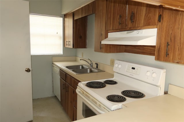 kitchen with white appliances, brown cabinets, extractor fan, light countertops, and a sink