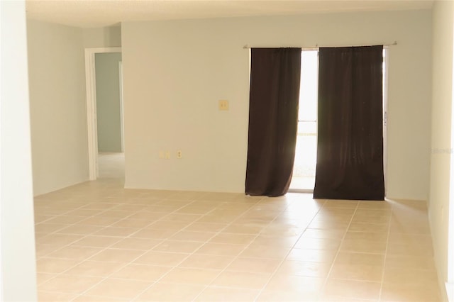 empty room featuring light tile patterned floors