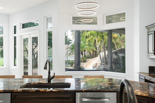 5138 Fairway Oaks Dr, Windermere, FL 34786 - kitchen with a sink and dark stone countertops
