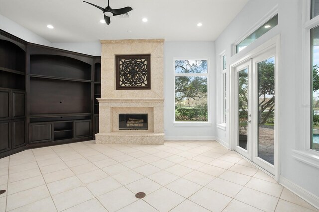 5138 Fairway Oaks Dr, Windermere, FL 34786 - unfurnished living room featuring plenty of natural light, a fireplace, and baseboards