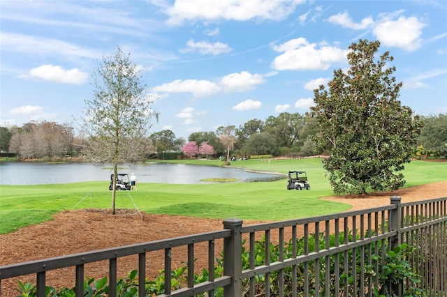 5138 Fairway Oaks Dr, Windermere, FL 34786 - view of community featuring a water view, view of golf course, fence, and a lawn