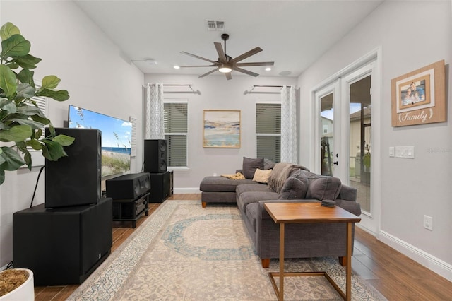 living room with hardwood / wood-style flooring and ceiling fan