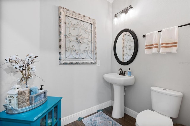 bathroom featuring toilet and hardwood / wood-style floors