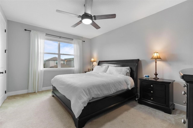 bedroom with light carpet and ceiling fan