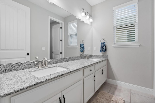 bathroom with tile patterned flooring and vanity