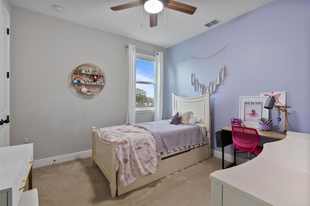 bedroom with light carpet and ceiling fan