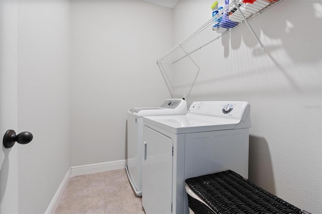 clothes washing area with washer and dryer