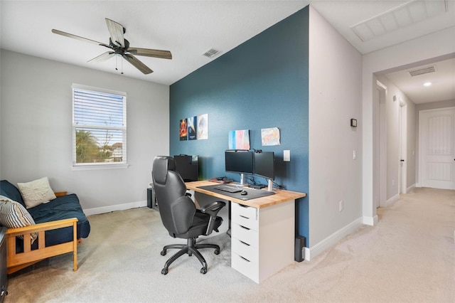 carpeted office featuring ceiling fan