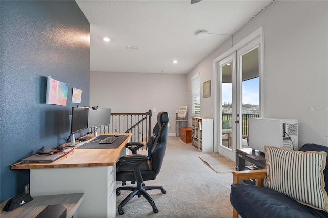 carpeted office with french doors