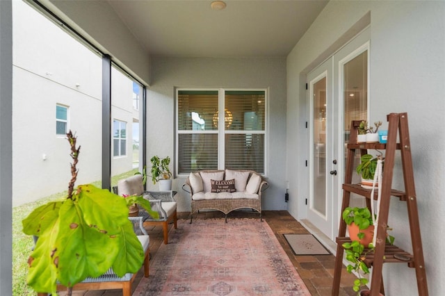 sunroom featuring french doors