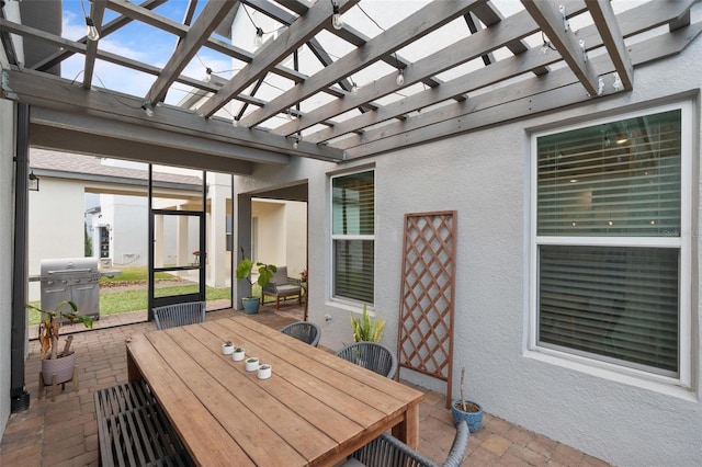 exterior space with grilling area and a pergola