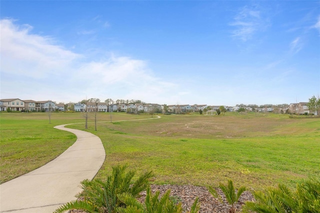 view of home's community with a lawn