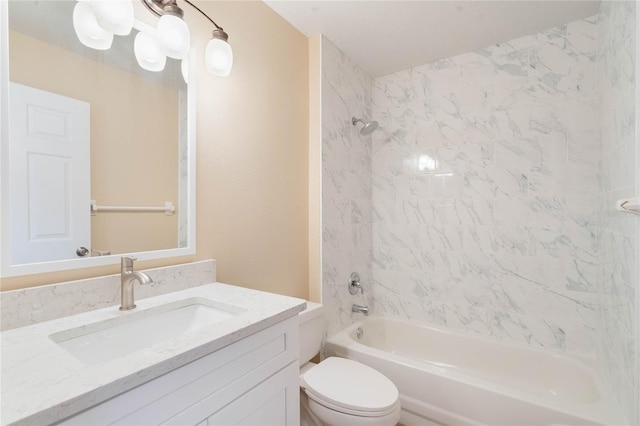 bathroom with shower / washtub combination, vanity, and toilet