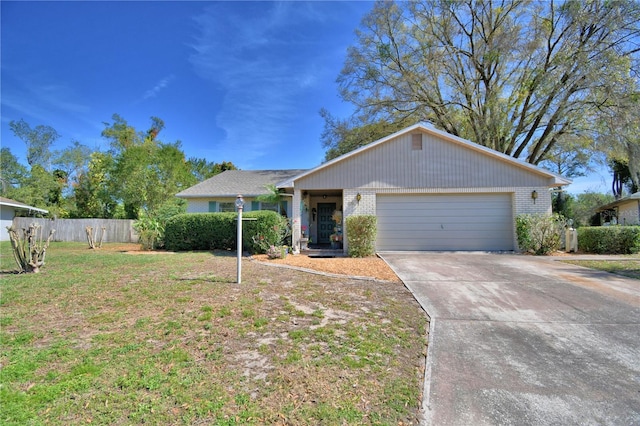 ranch-style home featuring brick siding, a front yard, fence, a garage, and driveway