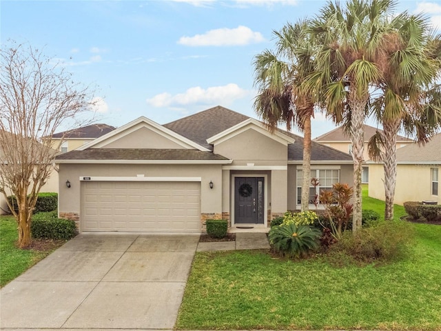 ranch-style home featuring an attached garage, stucco siding, concrete driveway, and a front yard