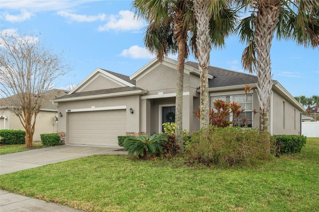 view of front of house with driveway, a shingled roof, stucco siding, an attached garage, and a front yard