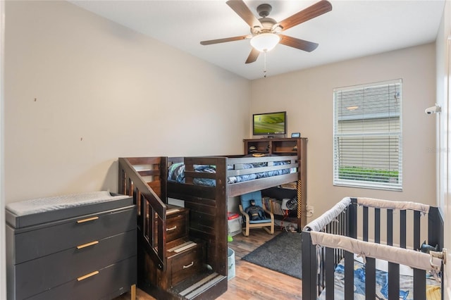 bedroom with ceiling fan and wood finished floors