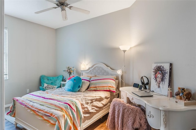 bedroom featuring ceiling fan and wood finished floors