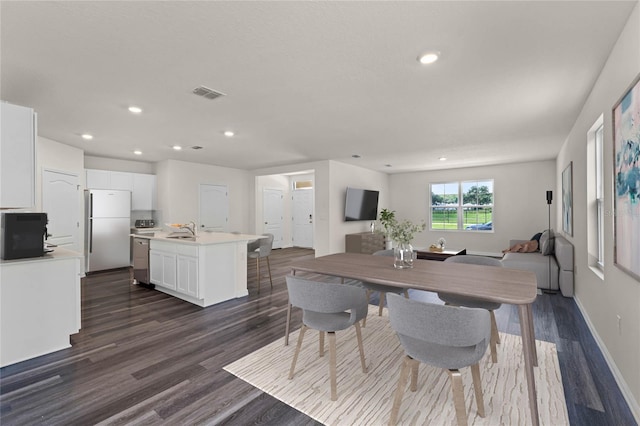 5614 Paddock Fence Ln, Apopka, FL 32712 - dining area with sink and dark wood-type flooring